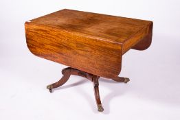 A 19TH CENTURY MAHOGANY DROP LEAF DINING TABLE with frieze drawer to one end, waisted column support