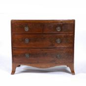 A 19TH CENTURY AND LATER MAHOGANY BOW FRONTED CHEST OF TWO SHORT AND TWO LONG DRAWERS with later