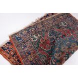 AN OLD BLUE GROUND ORIENTAL RUG with central medallion and triple banded border, 191cm x 150cm At