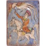 AN IZNIK STYLE POTTERY TILE with a figure on horseback, 15cm wide x 20cm high Condition: crazing and