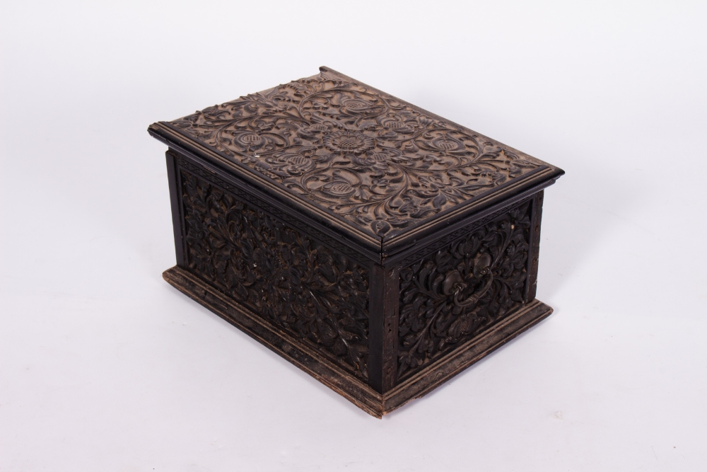 AN 18TH OR 19TH CENTURY ANGLO-INDIAN EBONY BOX with carved floral decoration and white metal hinges, - Image 2 of 5