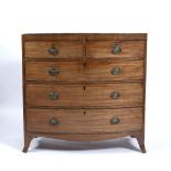 AN EARLY TO MID 19TH CENTURY MAHOGANY BOW FRONTED CHEST OF TWO SHORT AND THREE LONG DRAWERS on