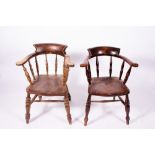 AN ASH AND ELM CAPTAINS TYPE WINDSOR CHAIR with carved saddle seat, turned spindle supports to the