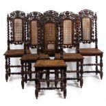 A SET OF SIX CAROLEAN STYLE OAK DINING CHAIRS the pierced crests carved with birds either side of