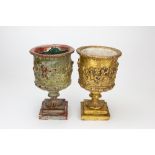 TWO SIMILAR GILDED, COMPOSITE POSSIBLY PLASTER, URNS each 21cm diameter x 34cm high Condition:
