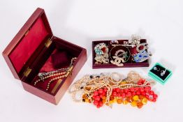 A COLLECTION OF COSTUME JEWELLERY in a leather bound box Condition: overall good condition, possible