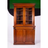 A 19TH CENTURY MAHOGANY BOOKCASE CABINET the glazed upper section enclosing adjustable shelves