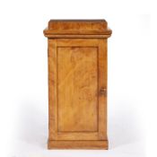 A 19TH CENTURY HARDWOOD VENEERED POT CUPBOARD of classical plinth form with panelled door to the