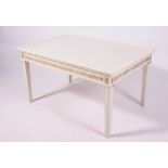 A MODERN WHITE PAINTED AND PARCEL GILT LOW OCCASIONAL TABLE with glass inset top, guilloche