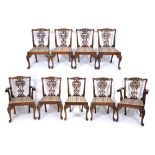 A SET OF NINE CHIPPENDALE STYLE MAHOGANY DINING CHAIRS with upholstered inset seats to include two