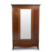 AN EDWARDIAN MAHOGANY WARDROBE with single mirrored door over two drawers, 131.5cm wide x 53cm