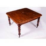 A VICTORIAN MAHOGANY WIND OUT EXTENDING DINING TABLE with turned tapering legs, 127cm x 120cm wide x