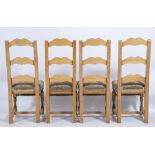 A SET OF FOURTEEN OAK LADDER BACK CHAIRS with upholstered seats and turned supports, 45cm wide x