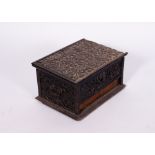 AN 18TH OR 19TH CENTURY ANGLO-INDIAN EBONY BOX with carved floral decoration and white metal hinges,