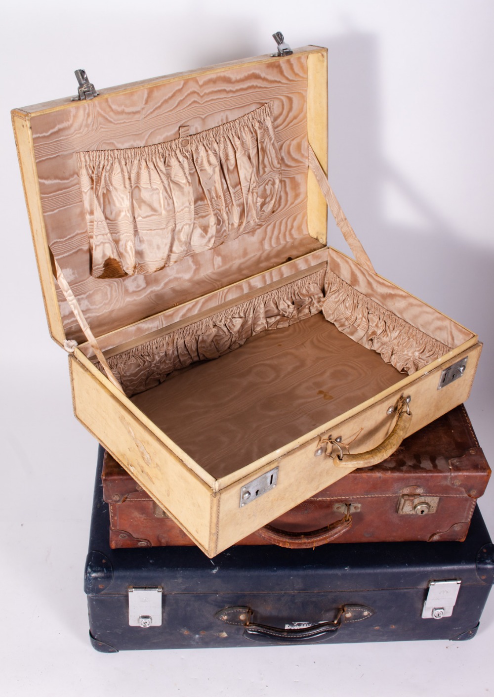 AN OLD LEATHER SUITCASE stamped 'Warranted Bullock Hide', 61cm wide together with a velum covered - Image 4 of 4