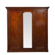 A VICTORIAN MAHOGANY TRIPLE WARDROBE with central mirrored door, two thirds of interior space fitted