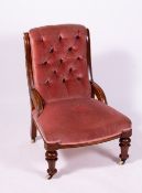 A VICTORIAN WALNUT LOW PINK DRAYLON UPHOLSTERED CHAIR with buttoned back and turned front legs, 62cm