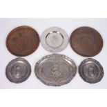 A PAIR OF ANTIQUE PEWTER PLATES embossed with family crests and having touch marks to the reverse,
