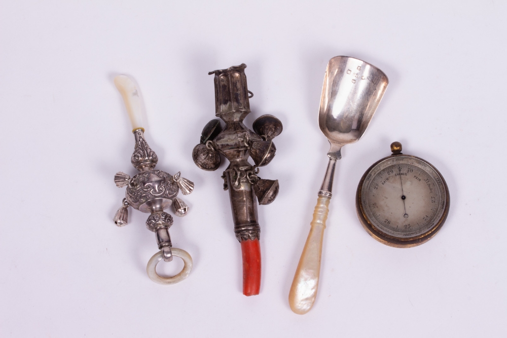 A SILVER AND MOTHER OF PEARL BABY'S RATTLE by Crisford & Norris Limited, with marks for Birmingham