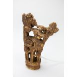 AN ANTIQUE SOUTH EAST ASIAN CARVED BONE GROUP of figures amongst foliage, 13cm high At present,