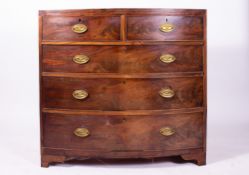 A GEORGE III MAHOGANY BOW FRONTED CHEST OF TWO SHORT AND THREE LONG DRAWERS with oval brass