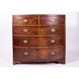 A GEORGE III MAHOGANY BOW FRONTED CHEST OF TWO SHORT AND THREE LONG DRAWERS with oval brass