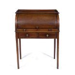 AN EDWARDIAN MAHOGANY ROLL TOP DESK with checkered stringing, the interior fitted with pigeon