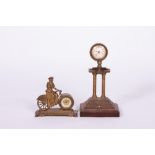 AN EDWARDIAN PARCEL GILT AND CAST BRASS NOVELTY MANTLE TIMEPIECE OR CLOCK in the form of a lady