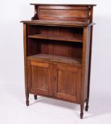 AN EDWARDIAN MAHOGANY BOOKCASE CABINET with raised panel back, two adjustable shelves over twin