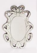 A VENETIAN STYLE WALL MIRROR with bow decoration, having engraved floral motifs, 50cm wide x 75cm