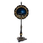 A VICTORIAN EBONISED POLE SCREEN the circular adjustable screen with reverse glass painted moonlit