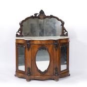 A VICTORIAN MARBLE TOPPED SIDE CABINET with raised carved mirrored back, serpentine marble top