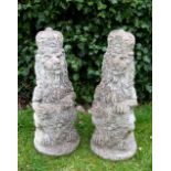 A PAIR OF WEATHERED COMPOSITE STONE ROYAL LIONS with shields, 23cm wide x 70cm high Condition: in