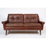 A 1960'S DANISH LIGHT BROWN LEATHER UPHOLSTERED TWO SEATER SETTEE with four turned legs, 145cm