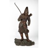 A BRONZE SCULPTURE OF A JAPANESE WARRIOR holding his bow in one hand and a small bird in the