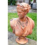 AN OLD TERRACOTTA BUST OF APHRODITE after the antique, on a turned socle, stamped P Ipsen, and