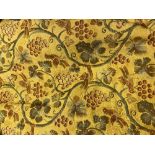 A PAIR OF YELLOW GROUND AND LINED FABRIC CURTAINS decorated with grapevines and birds, each