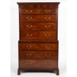 A GEORGE III MAHOGANY CHEST ON CHEST with dentil cornice above two short and six long drawers, the