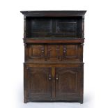 AN 18TH CENTURY WELSH OAK TRIDARN of pegged construction, the upper panelled hood with turned