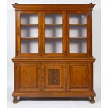 AN OAK AND BURR OAK VENEERED CABINET the upper section with three glazed cupboard doors enclosing