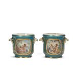 A PAIR OF SEVRES PORCELAIN SMALL JARDINIERES painted with classical scenes and flowers, 12cm high (