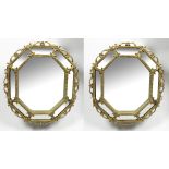 A PAIR OF GILT FRAMED POSSIBLY CONTINENTAL WALL MIRRORS of octagonal form, with central mirror plate