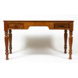 A HARDWOOD DESK with two frieze drawers and turned supports, 135cm wide x 75cm deep x 76cm high