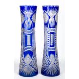 A PAIR OF LARGE 19TH CENTURY BOHEMIAN BLUE CUT GLASS VASES each 14.5cm diameter x 60.5cm in height