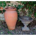 A SMALL CAST IRON URN of squat campana form with an egg and dart border, 43cm diameter x 36cm high