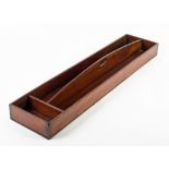 A 19TH CENTURY MAHOGANY CHURCH WARDEN'S PIPE TRAY with two long and one narrow compartments and