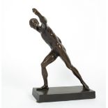 A BRONZE FIGURE OF A GREEK ATHLETE after the antique, 30.5cm wide x 40cm high Condition: damage to