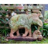 AN ANTIQUE INDIAN CARVED RED SANDSTONE SCULPTURE depicting an elephant, possibly originally part