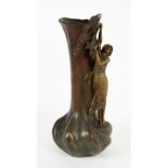 A LATE 19TH CENTURY CONTINENTAL BRONZED SPELTER VASE with a girl reaching up to a flowering