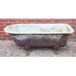 AN ANTIQUE ENAMELLED CAST IRON BATH 148cm in length x 66cm deep x 53cm high Condition: some